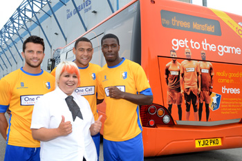 mansfield town fc threes celebrate together